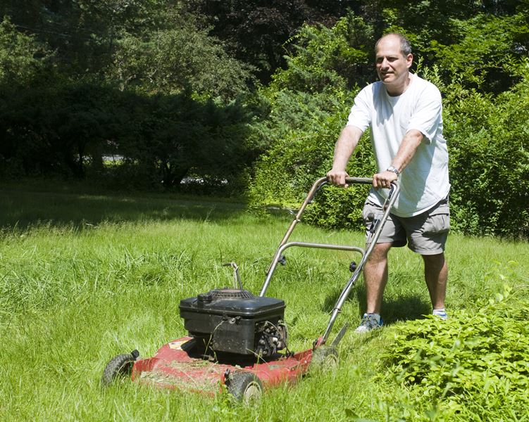 a man mowing his lawn